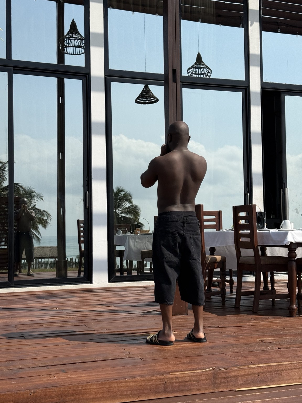 SauciBossy in an interior with tall windows